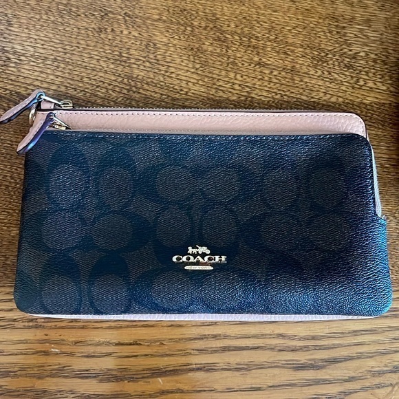 Coach Handbags - Coach dual pocket wallet monogrammed front with a pebbled, leather backside